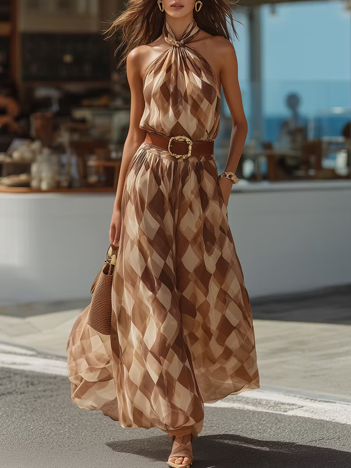 Elegant brown halter maxi dress with chic geometric print, perfect for summer parties or vacation wear.