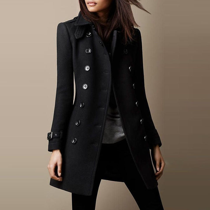 Olive green women's double-breasted tailored long coat with structured collar, a classic winter fashion piece.