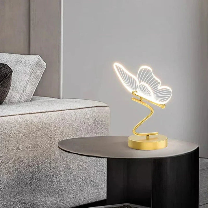 Modern LED desk lamp with unique butterfly design, ideal for bedroom or living room lighting.