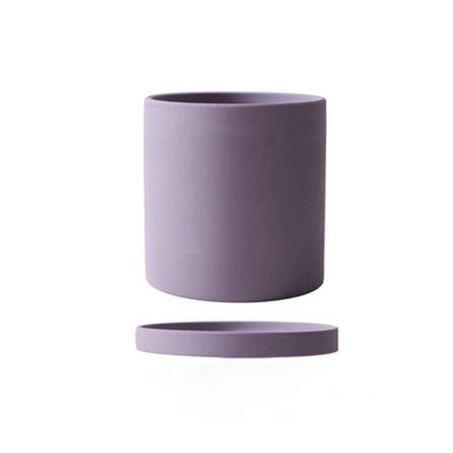 Elegant ceramic pot with drainage, suitable for various indoor plant varieties.