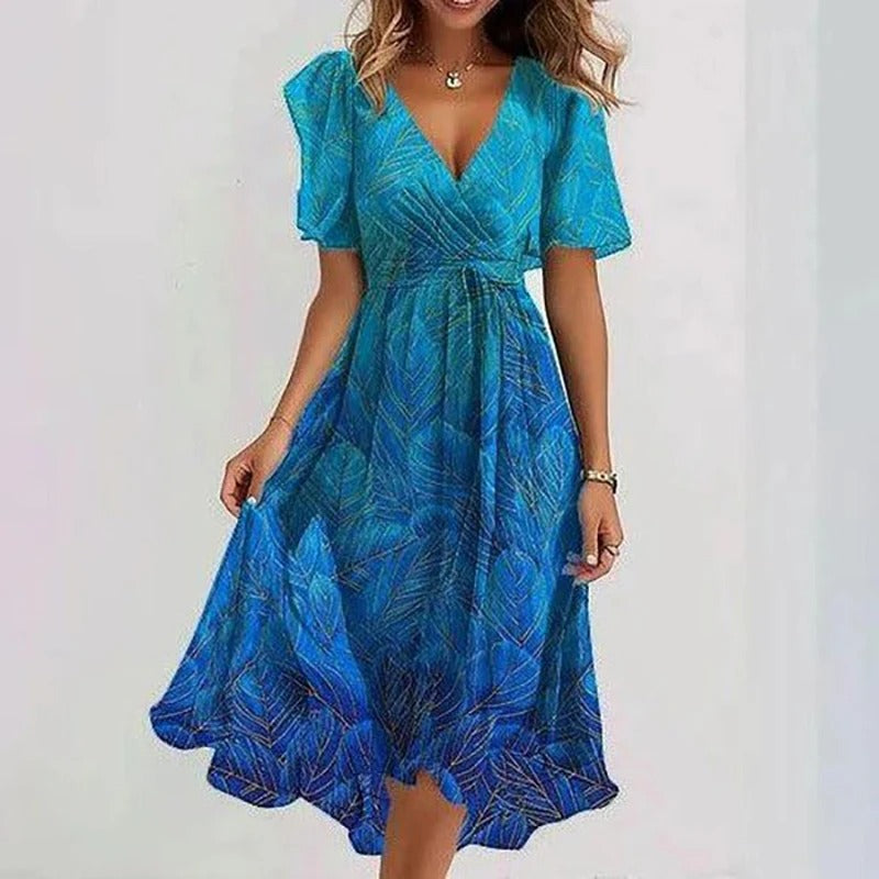 Women's elegant colorful midi dress. Stylish, versatile occasion wear for summer events.