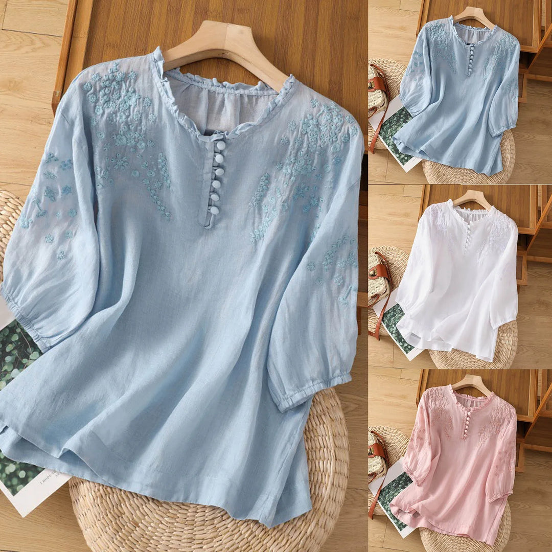 Detailed embroidered floral button-front blouse, women's elegant long sleeve top for versatile spring fashion.