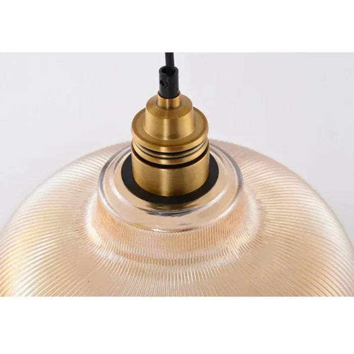 Contemporary glass pendant lighting fixture, elegant and modern decorative lamp for stylish home interiors.