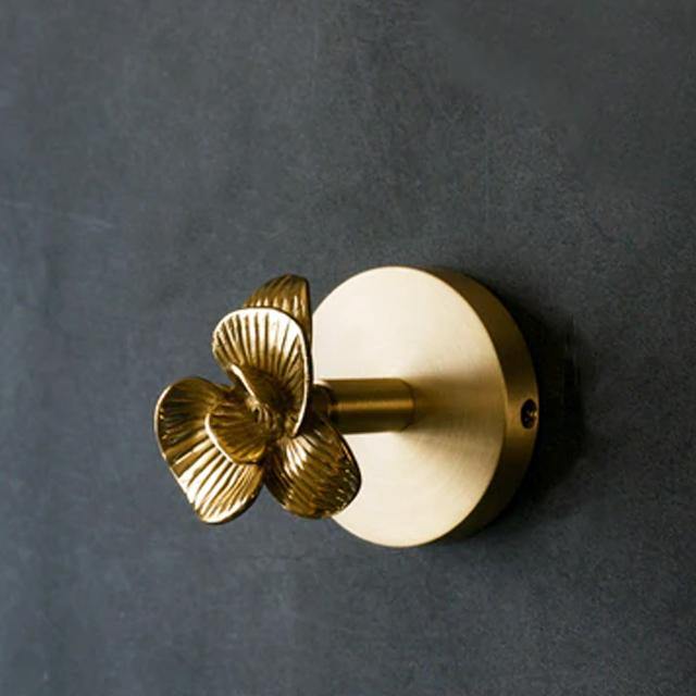 Luxurious gold animal wall hook, an elegant home decor statement piece.