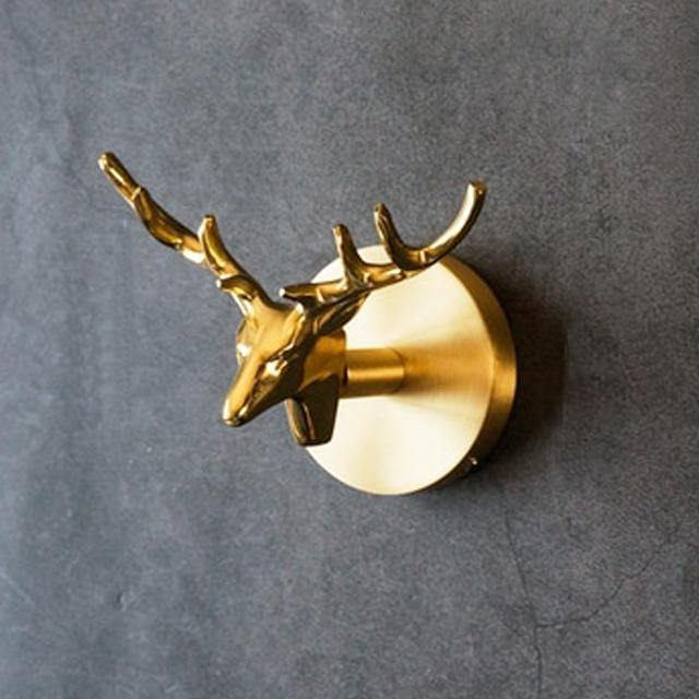 Functional gold animal wall hook, ideal for elegant home organization and decor.