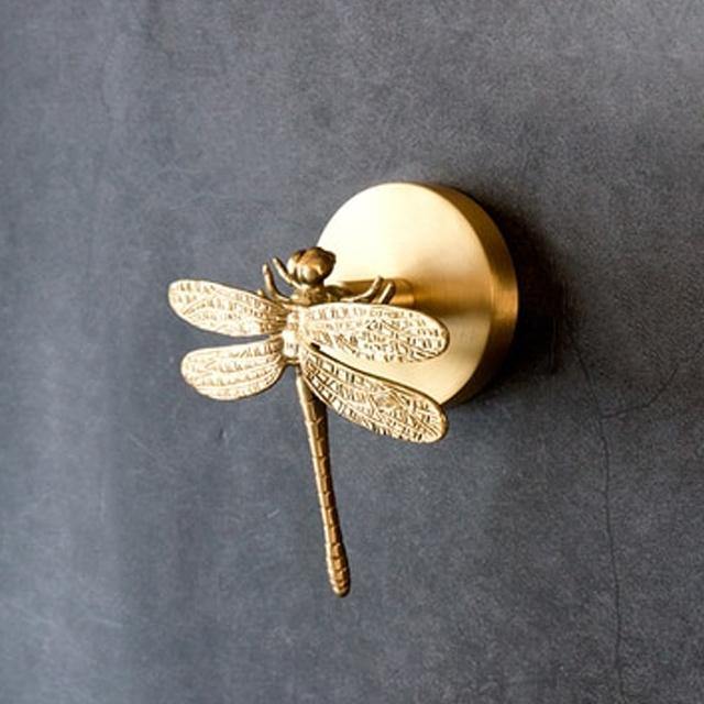 Decorative gold animal hook, an elegant wall decor piece for home accents.