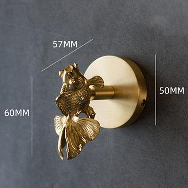Artistic gold animal wall hook, enhancing elegant home decor and entryway.
