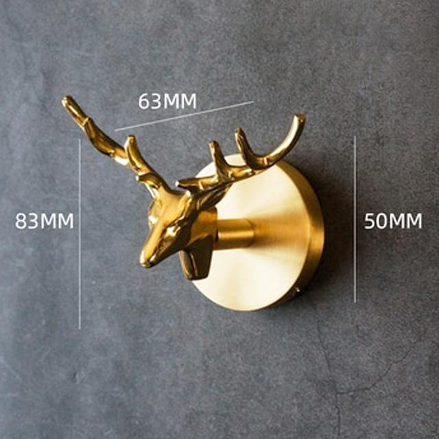 Gold finish animal wall hook, practical & decorative storage solution for walls.