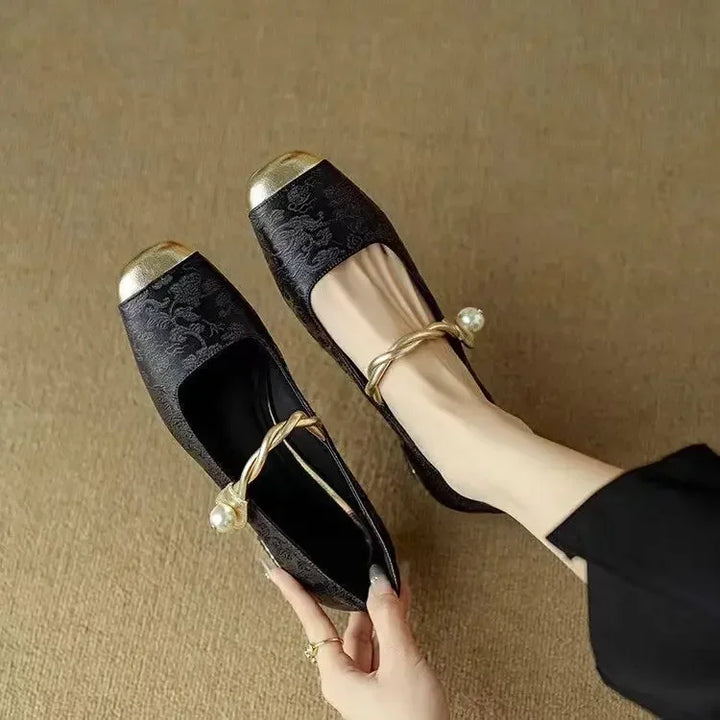 Classic black women's pumps, square toe design, elevated with a unique studded heel. Great evening shoes.