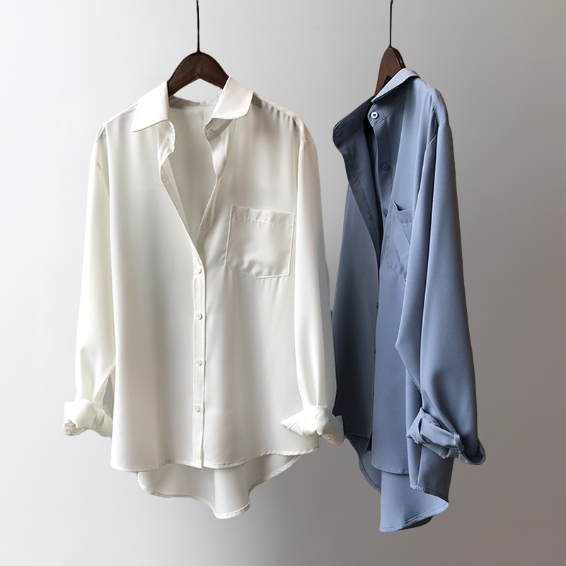 Flowy women's high-low blouse. Long sleeve elegant top, versatile for day-to-night fashion trends.
