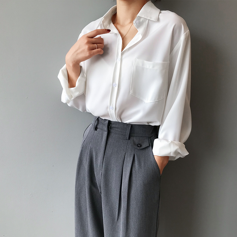 Chic women's high-low blouse with a flattering cut. Elegant long sleeve top, new in womenswear.