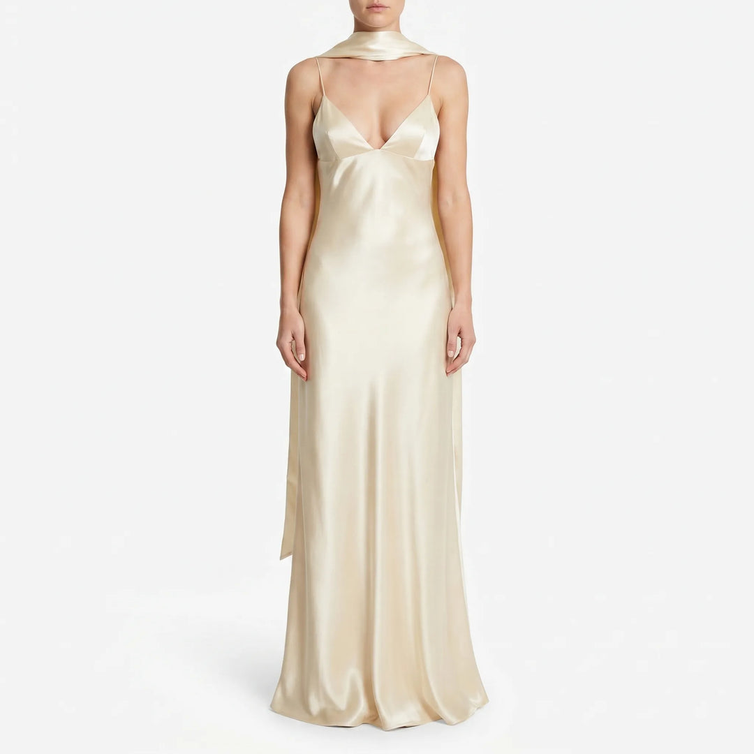 Chic light yellow women's open back slip dress with an elegant scarf detail. Ideal midi length for summer evening wear.