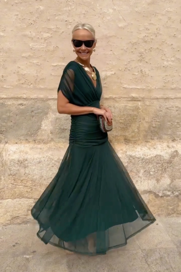 Elegant V-neck maxi dress with pleated waist, sophisticated women's formal wear for special occasions.