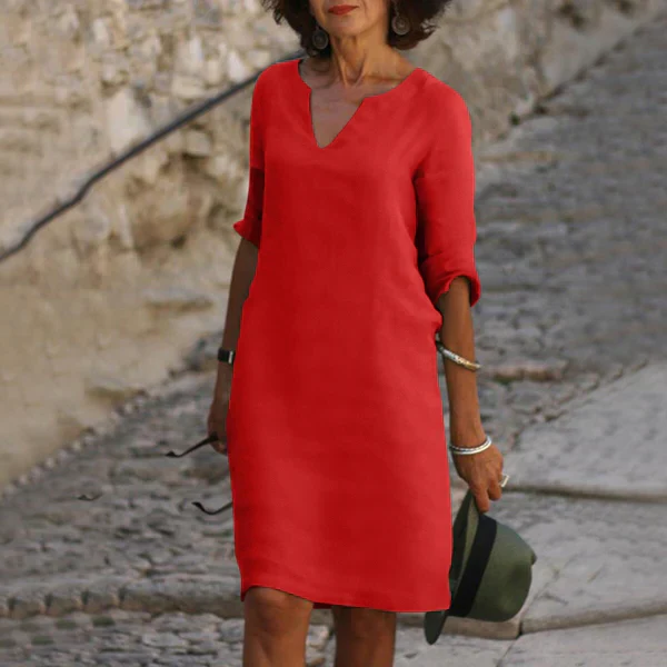 Stylish spring/summer women's V-neck midi dress with three-quarter sleeves; perfect for day to evening looks.