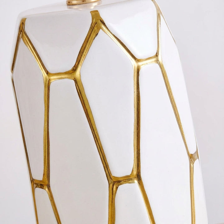 Beautiful ceramic table lamp with a sophisticated fabric shade, ideal for living room or bedroom accent lighting.
