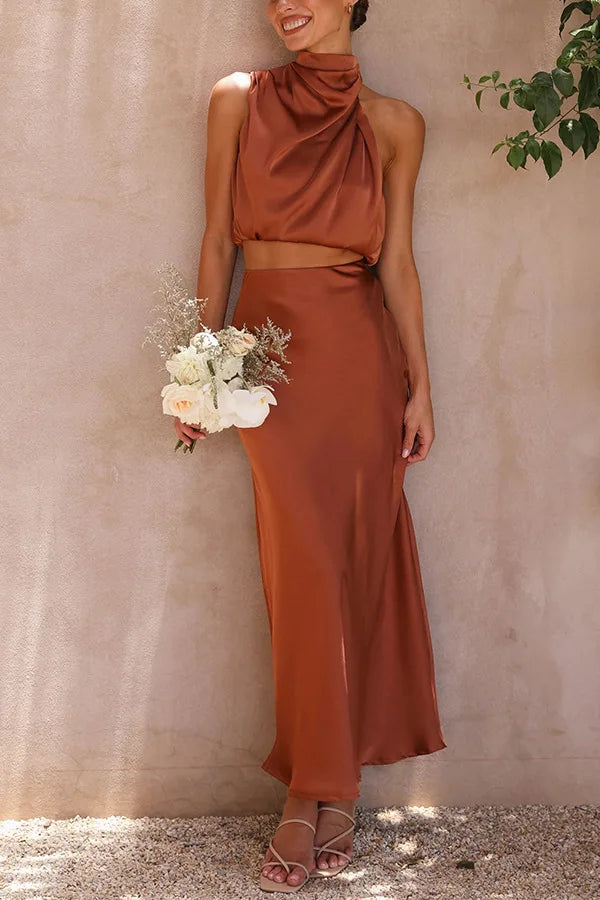 Elegant women's 2-piece evening set with draped halter top and flowing maxi skirt for formal occasions.