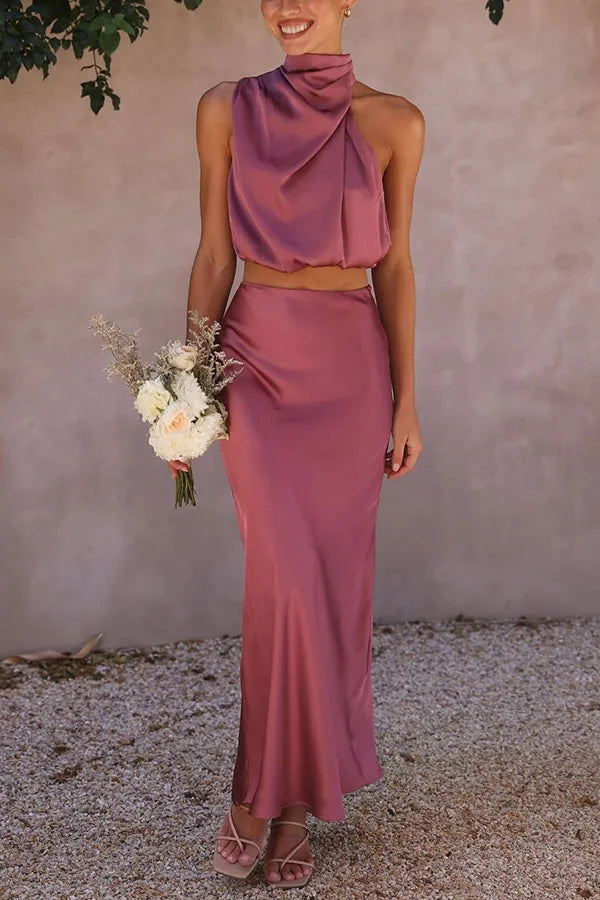 Chic women's draped halter top & maxi skirt set, perfect for special occasion evening wear. Minimalist style.