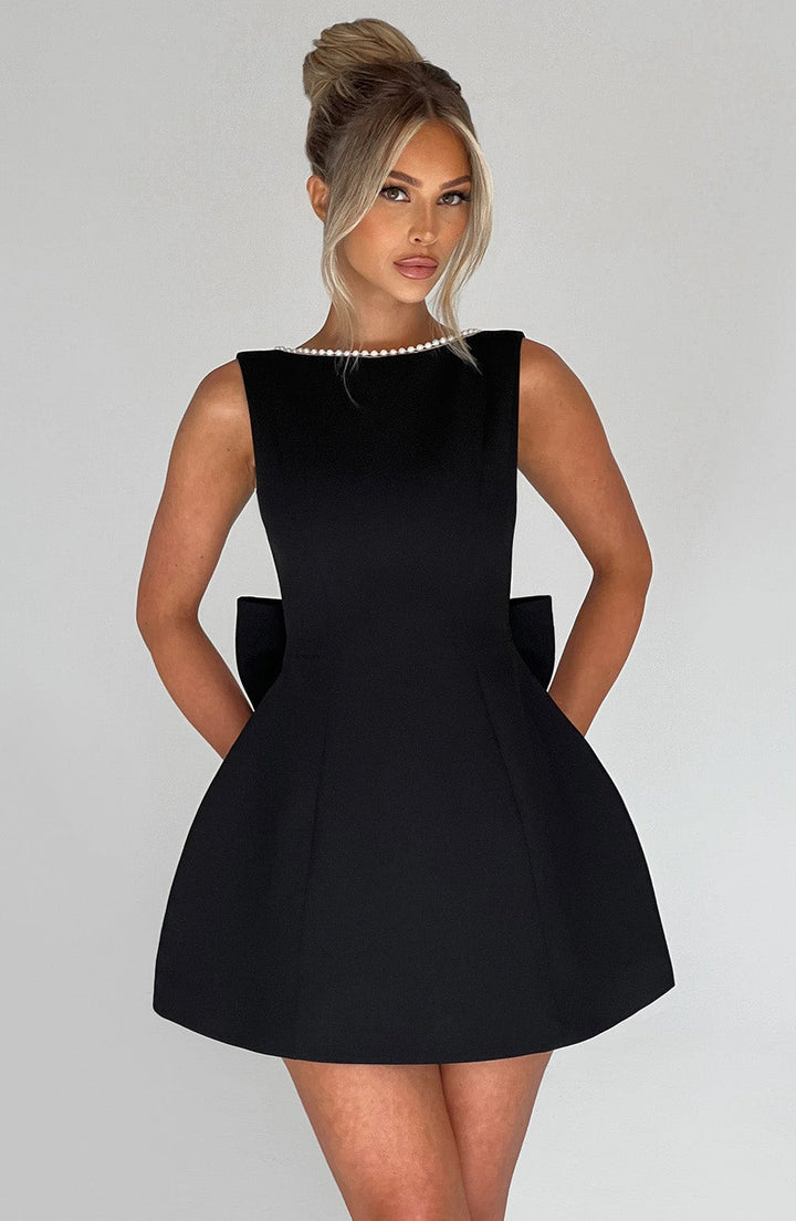 Women's elegant cocktail dress: A-line mini style with charming pearl details for special events.