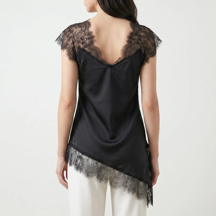 Sophisticated women's asymmetrical blouse with sheer details, ideal for versatile evening wear or chic summer style.