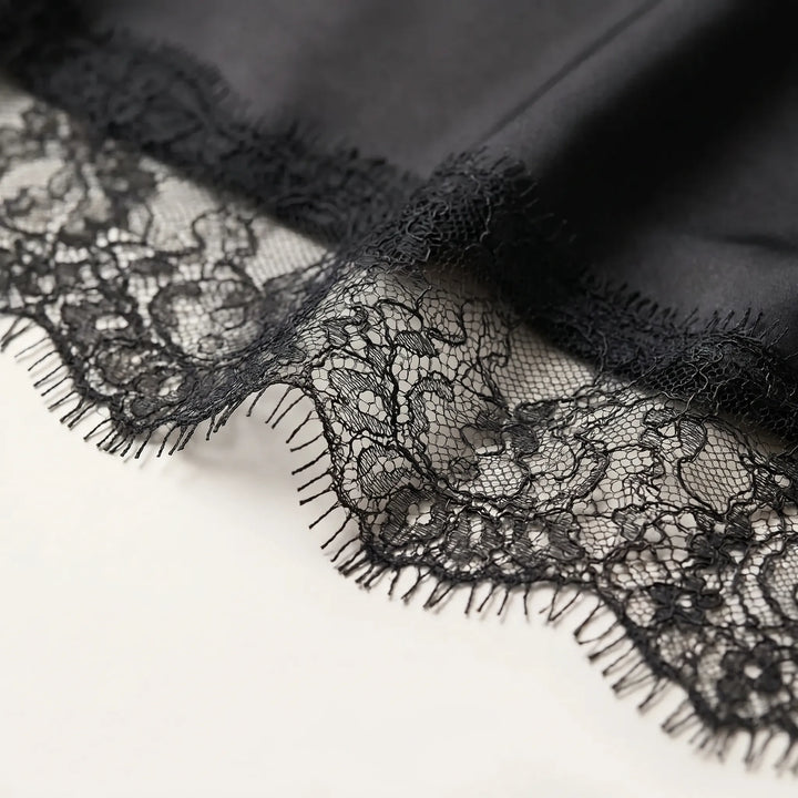 Women's fashion asymmetrical blouse featuring elegant sheer details & a stylish hem, perfect for modern apparel.