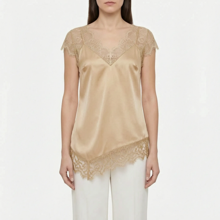 Stylish women's elegant top featuring an asymmetrical cut, sheer panels, & a flattering V-back. Modern summer wear.