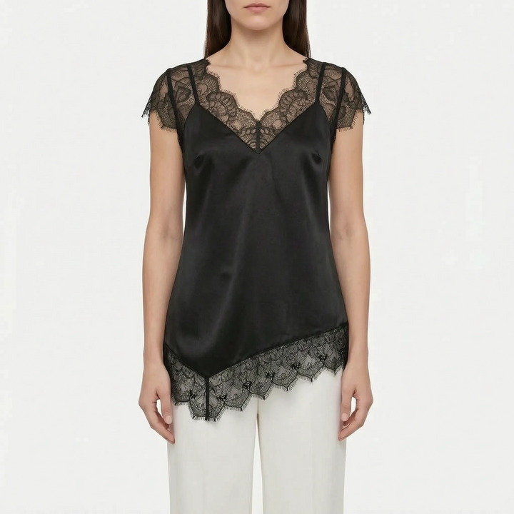 Women's versatile asymmetrical top with sophisticated sheer details. Sleeveless blouse for elegant evening or day wear.
