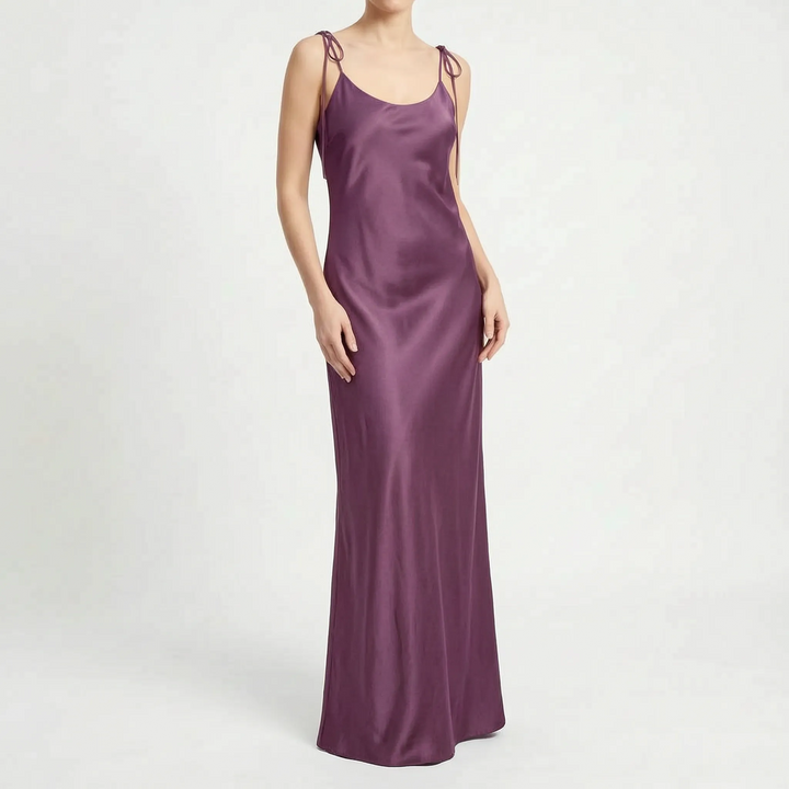 Women's elegant backless floor-length slip dress, a sophisticated choice for formal evening wear.