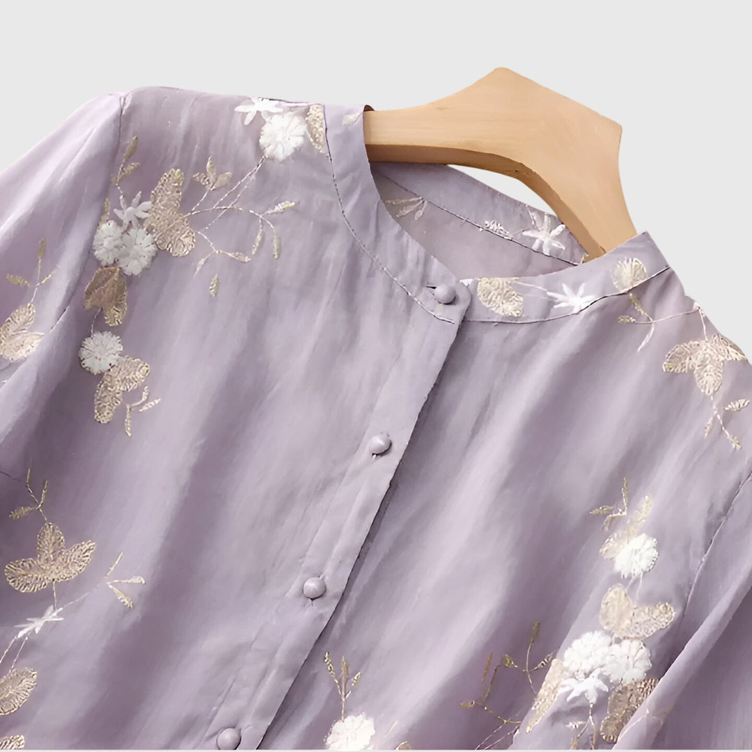 Women's elegant floral embroidered blouse, a fashionable spring/summer top with a relaxed, comfortable fit.