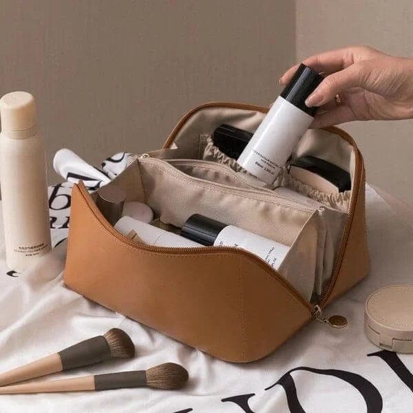 Stylish travel cosmetic bag with organized compartments for women's daily essentials and personal care.