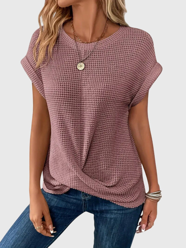 Stylish women's long sleeve crew neck blouse. Versatile and comfortable for elegant work or casual outfits.
