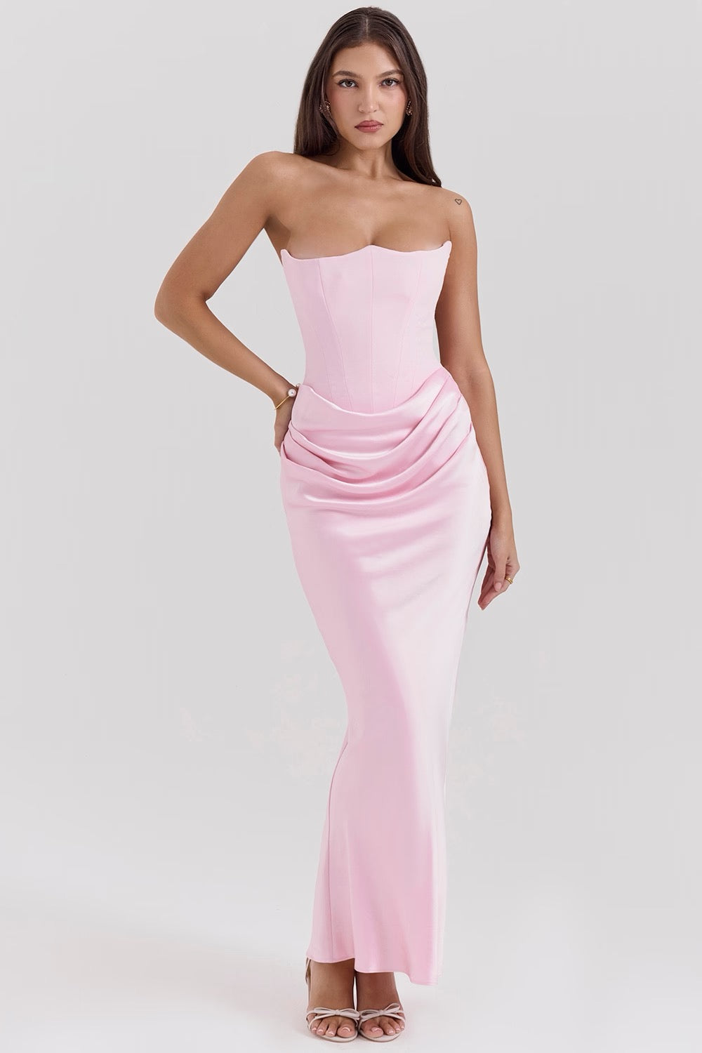 Sophisticated women's homecoming dress with draped strapless design.