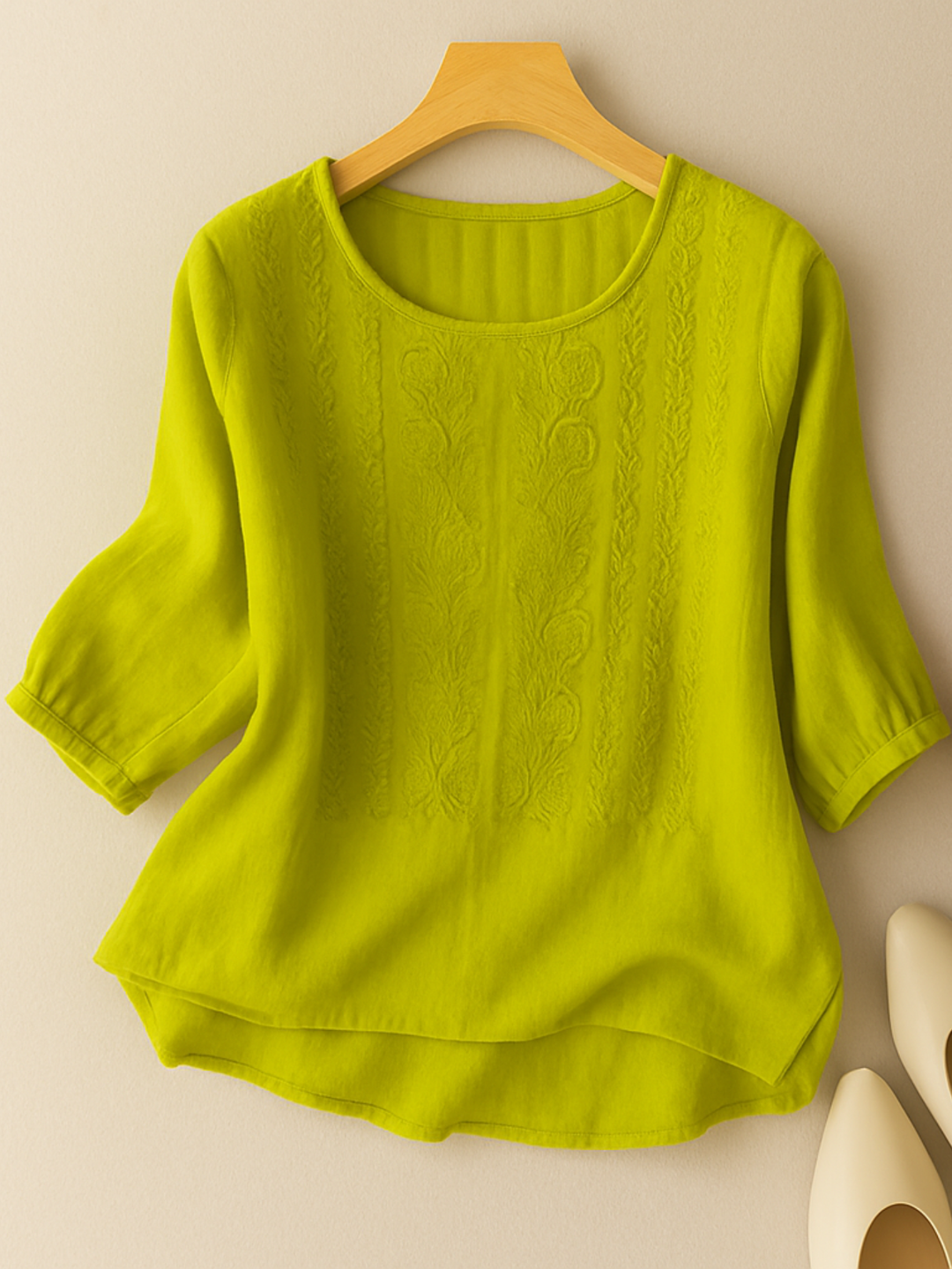 Feminine women's blouse featuring intricate embroidery and a comfortable, relaxed fit design.