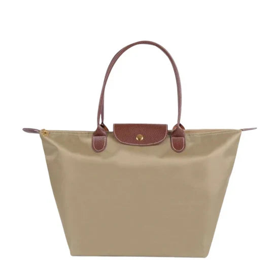 Classic faux leather shoulder bag for women. This elegant & spacious everyday bag keeps your essentials organized.