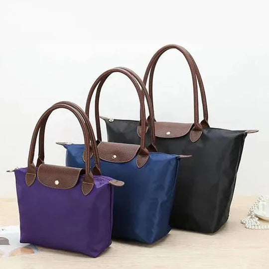 Sophisticated women's faux leather everyday shoulder bag. Spacious design & organized interior for all your necessities.