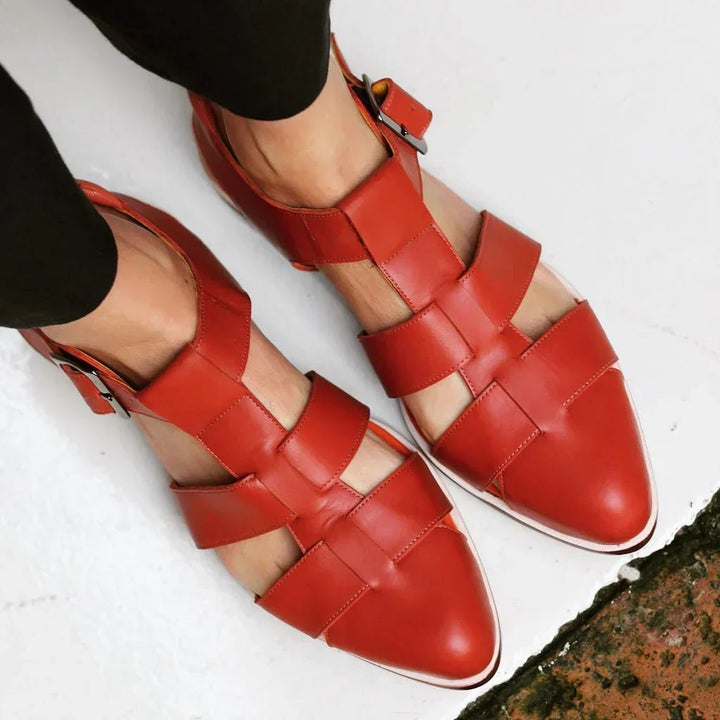 Elegant women's flat strap sandals for comfortable summer wear. Stylish slip-on casual footwear.