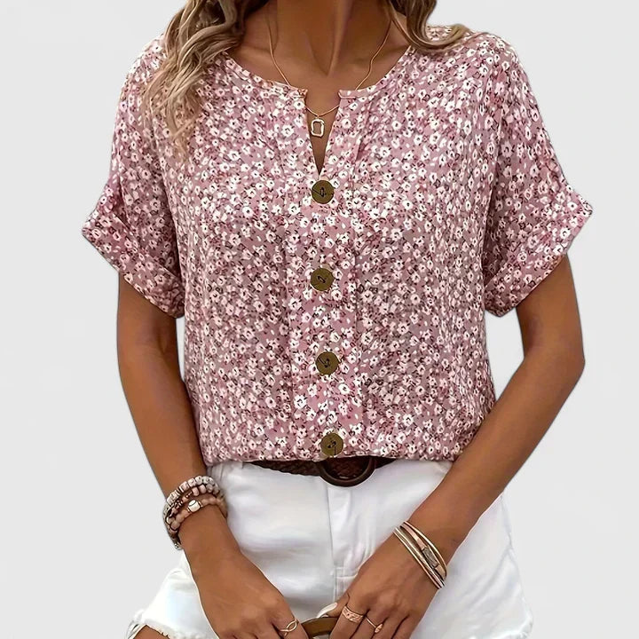 Chic button-up floral blouse for women, featuring a vibrant print & long sleeves. Ideal for daily fashion.