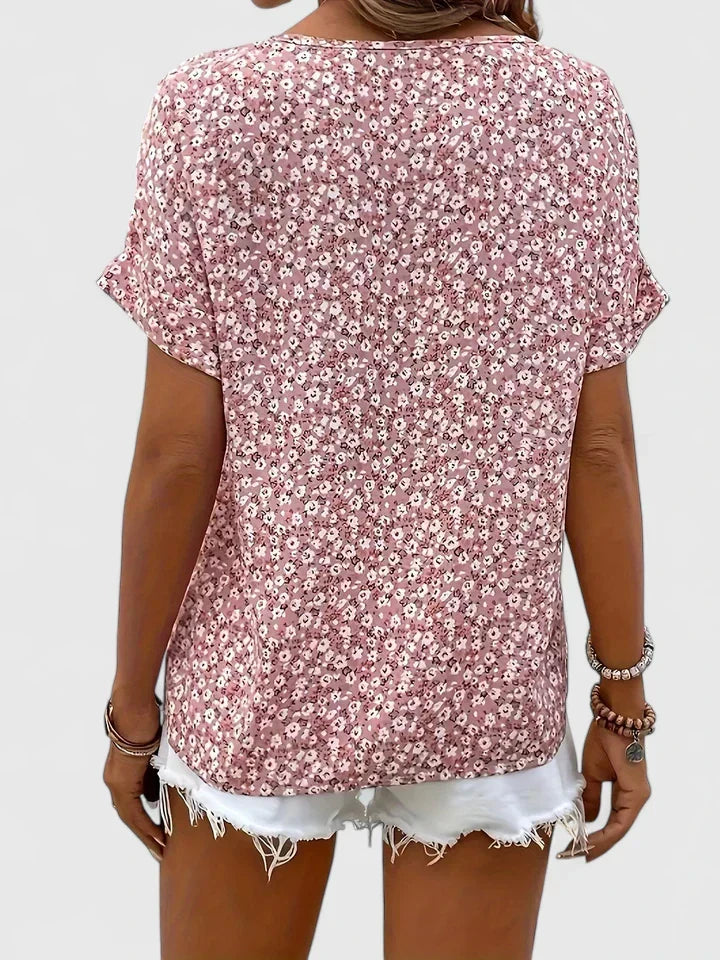 Beautiful floral print long-sleeve blouse for women. This chic top offers versatile elegant style.