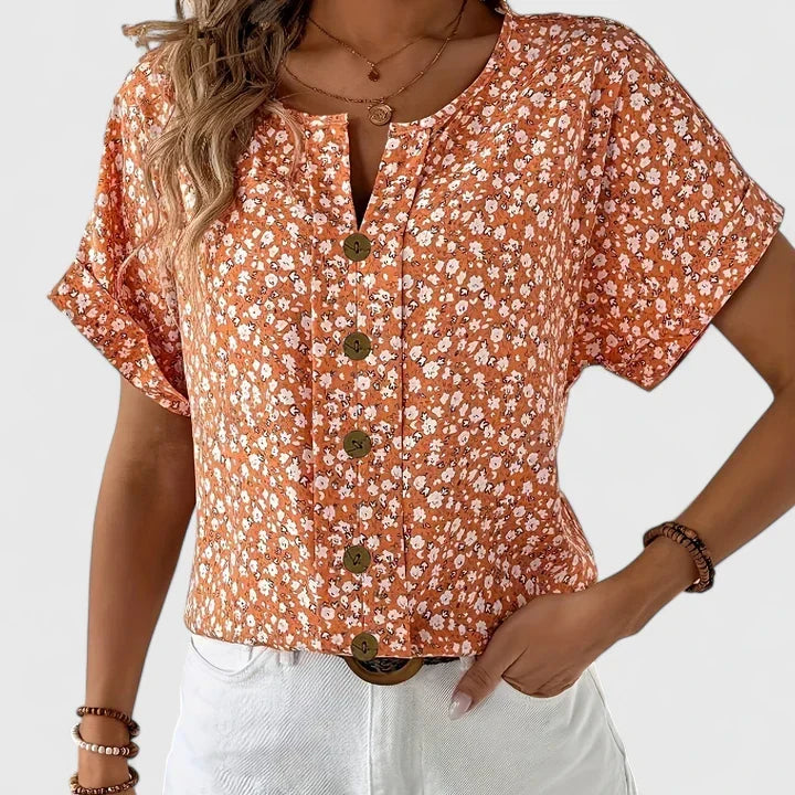Versatile women's floral button-up blouse. Elegant long-sleeve top for a fashionable casual or office look.