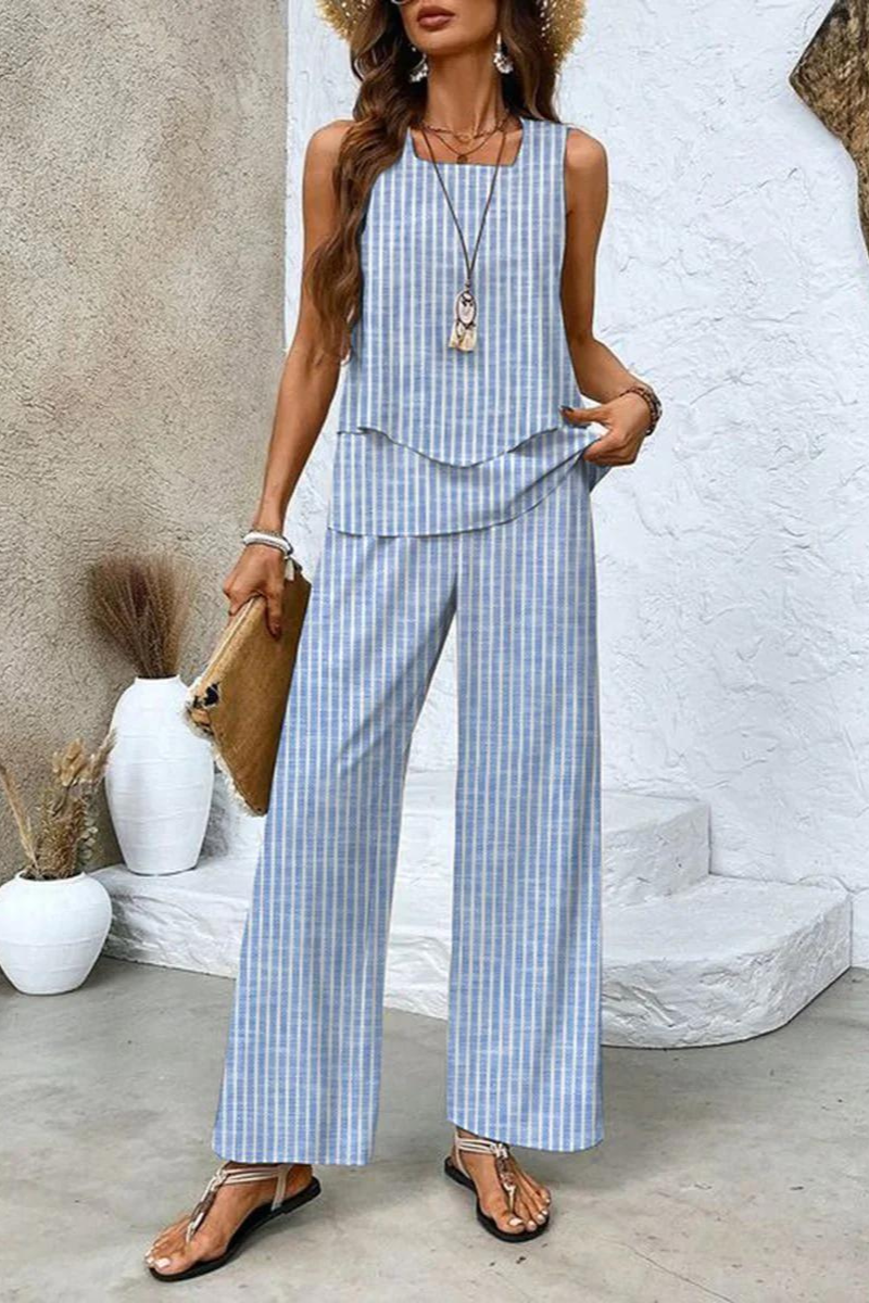 Modern women's chic floral top and wide-leg trousers set. Comfortable and stylish two-piece spring outfit.