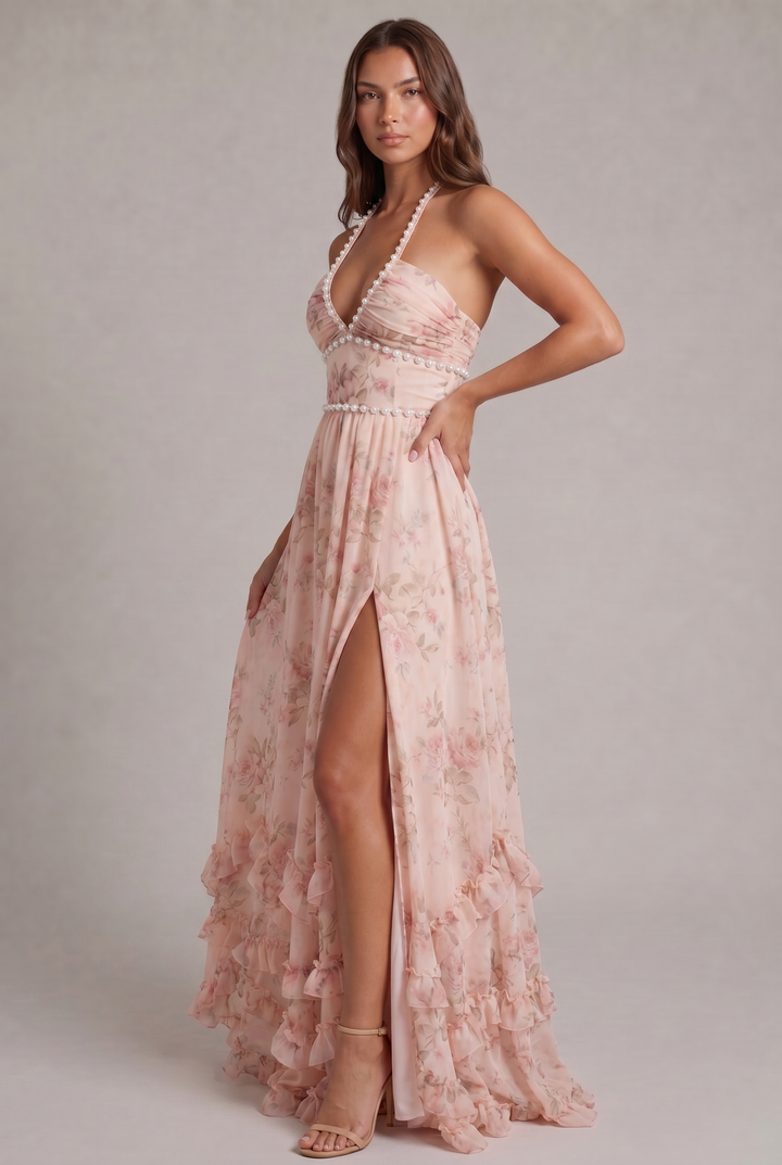Pink floral maxi dress for women, featuring a chic halter neck, ruffles, and elegant pleats. Ideal for parties.