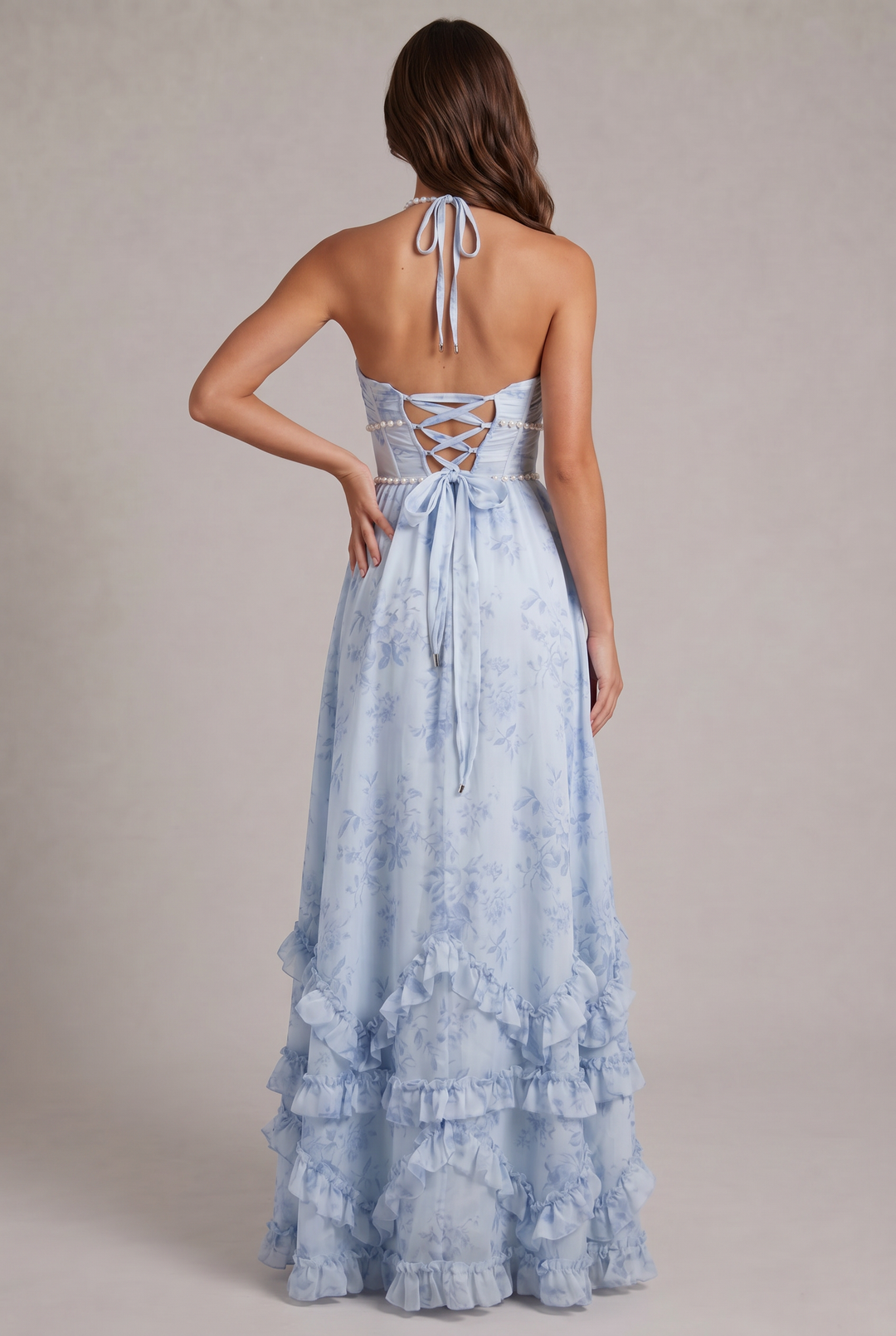 Lightweight women's floral maxi dress with a flattering halter neck. Elegant pleated design, perfect for summer celebrations.