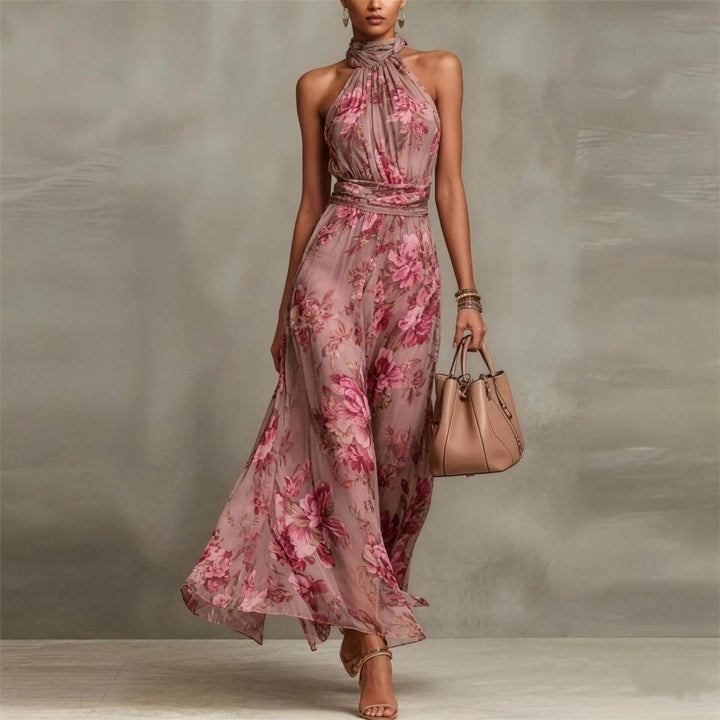 Elegant women's floral maxi dress with halter neck & ruched waist, perfect for a wedding guest or summer party.