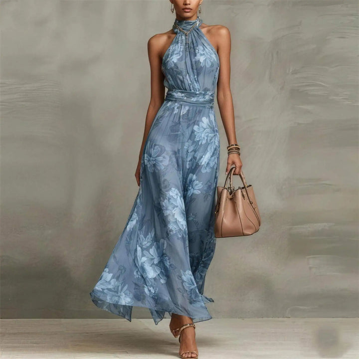 Chic floral maxi wedding guest dress for women, sleeveless with a halter neck and ruched detail, elegant & comfortable.