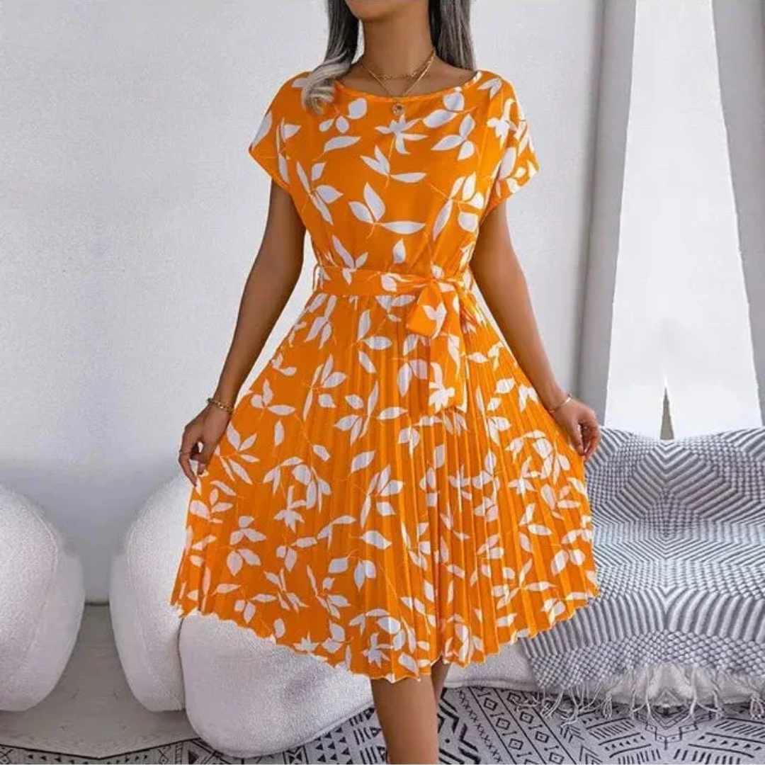 Women's elegant floral pleated midi dress. A comfortable spring fashion staple for any occasion.
