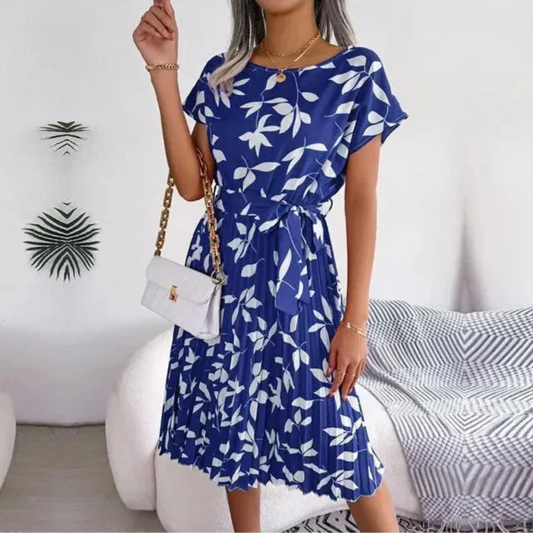 Stylish women's floral pleated midi dress. A versatile and comfortable choice for spring & summer fashion.