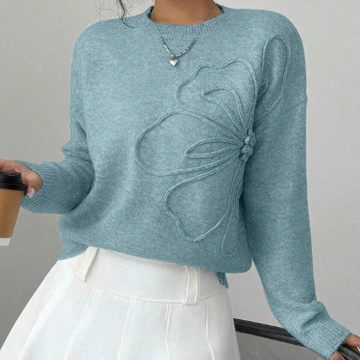 Cozy women's floral pullover sweater featuring a beautiful flower pattern, long sleeves, and comfortable crew neck.