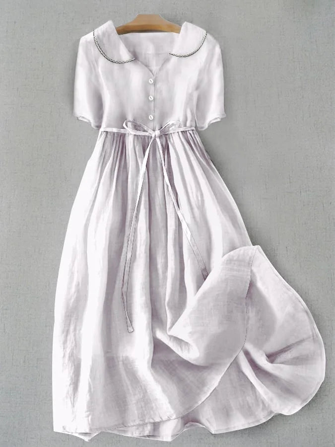 White women's Isla midi dress, a timeless mid-sleeve style for comfortable, elegant, and casual summer wear.