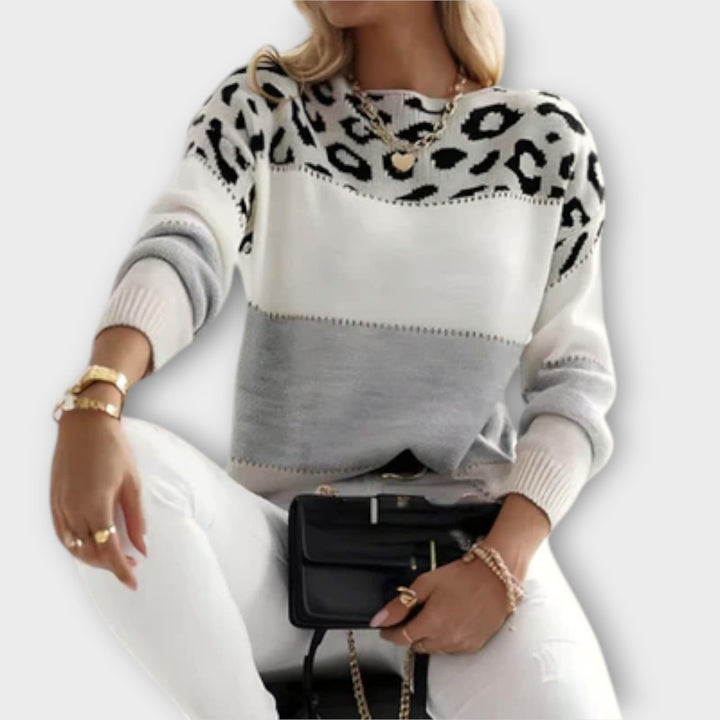 Elegant women's leopard print sweater, a chic long-sleeve pullover for stylish winter fashion and cozy comfort.