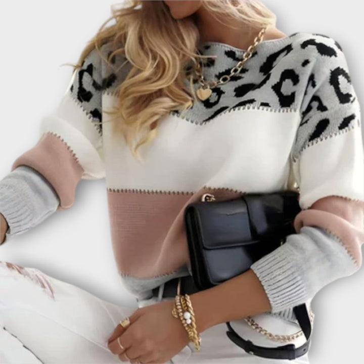 Women's elegant leopard print sweater, a stylish and comfortable long-sleeve pullover for chic winter wear.