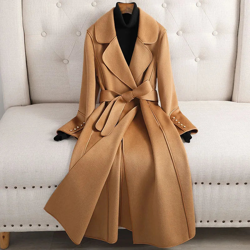 Elegant women's long trenchcoat with a belted fit, perfect for versatile autumn and winter fashion & casual outerwear.
